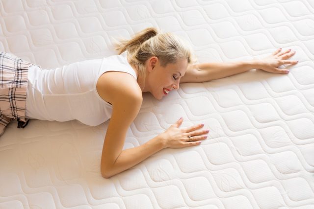 Woman enjoying her new comfortable mattress